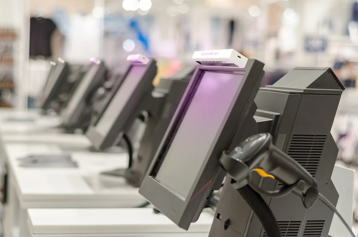 GermScan device concepts on a row of retail checkout terminals